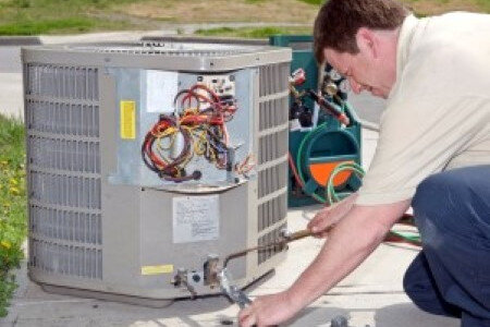 Texas Aces HVAC technician installing air conditioner in Dallas, TX