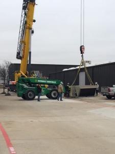HVAC unit being prepared to be lifted onto a building in Dallas, TX.