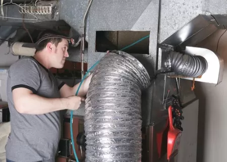 Texas Aces HVAC technician installing a heating unit in Dallas, TX