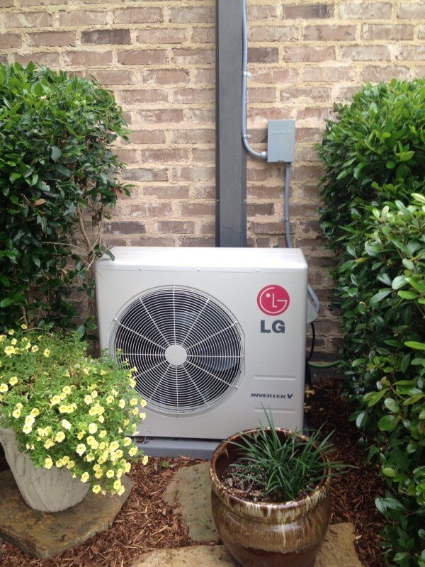 A residential LG HVAC system that is located on the side of the house